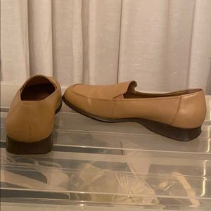 A pair of tan loafer by Dexter